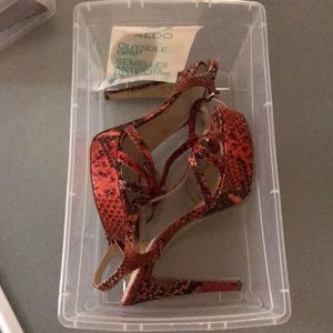 Red snake print stiletto heels